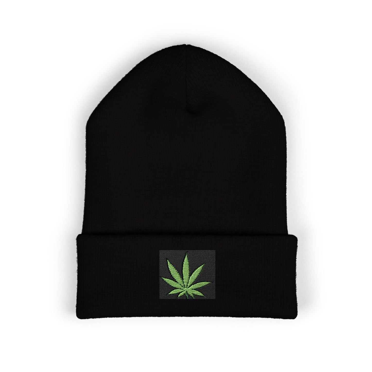 Black beanie with a green cannabis leaf patch.
