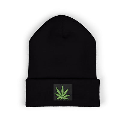 Black beanie with a green cannabis leaf patch.