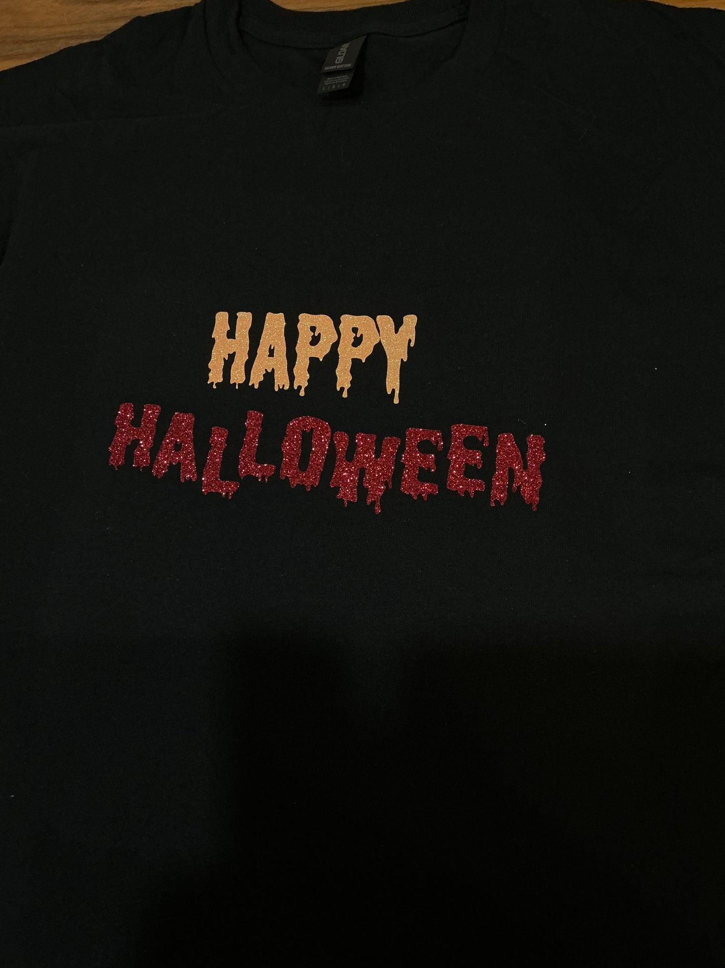 Black shirt with 'Happy Halloween' text in orange and red